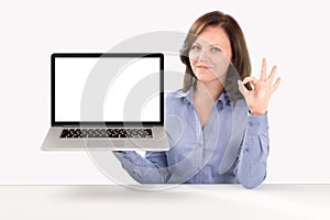 Business woman is holding a laptop photo