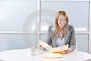 Business woman holding legal documents