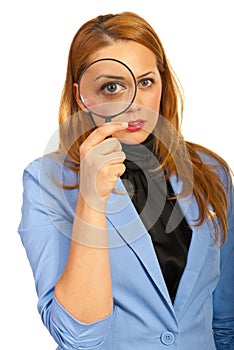 Business woman holding magnifier
