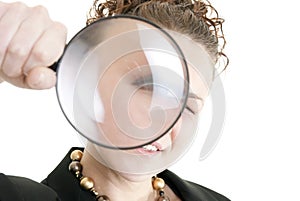 Business woman holding a magnifying glass