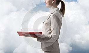 Business woman holding open notebook