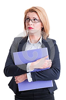 Business woman holding portfolio and thinking