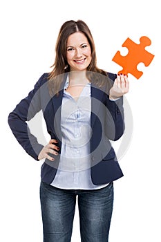 Business woman holding a puzzle piece