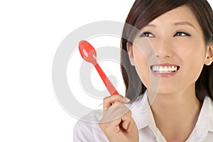 Business woman holding tablespoon