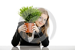 Business Woman holding a vase with a plant