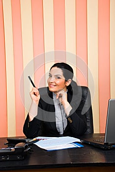 Business woman indicate with pencil