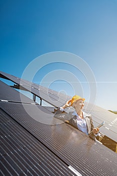 Business woman or investor inspecting her solar farm