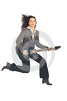 Business woman jumping with guitar