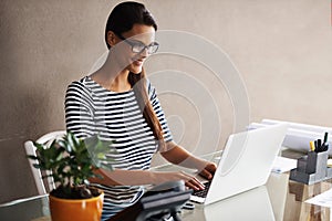 Business woman, laptop and architecture at office desk for project, planning and research on design software. Young