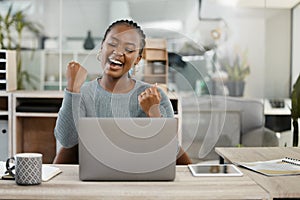 Business woman, laptop and celebration with fist for winning, success or promotion bonus at office. Happy black woman