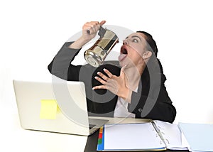 Business woman at laptop computer desk drinking coffee excited and anxious in caffeine addiction