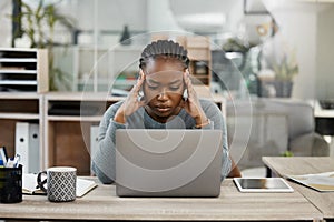 Business woman, laptop and headache in stress, burnout or depression in doubt, fail or mistake at office. Frustrated