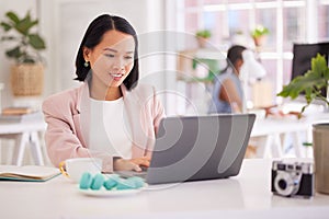 Business woman, laptop and smile for web design, communication or online marketing at the office. Happy female employee