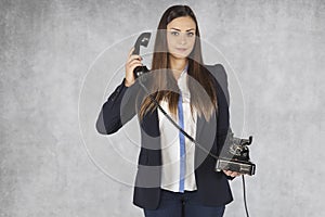 Business woman listens to a customer on the phone