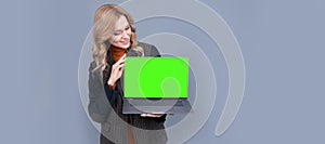 Business woman look at laptop with blank neon green screen for copy space, notebook. Woman portrait, isolated header