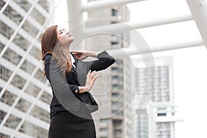 Business woman look up and flick her hair at outdoor. Business and Beauty concept