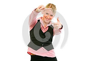 Business woman looking through frame made fingers