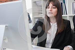 Business woman looking at screen