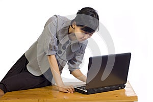 Business Woman Looking Serious at Her Laptop