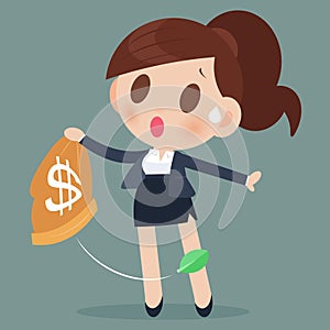 Business woman losing money from a bag