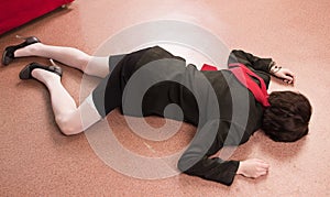 Business woman lying on the floor