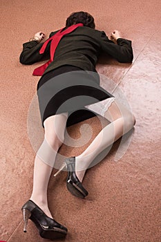 Business woman lying on the floor