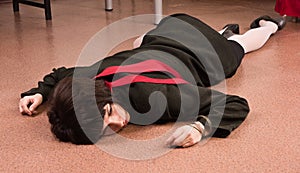 Business woman lying on the floor.