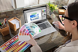 Business Woman Making Color Selection For Logo Design