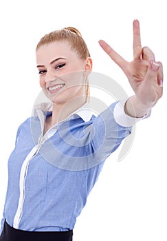 Business woman making victory gesture