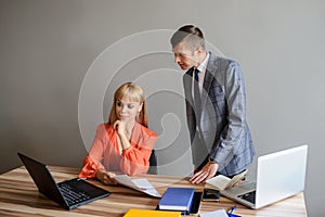 A business woman and man at a office desk  working at the project