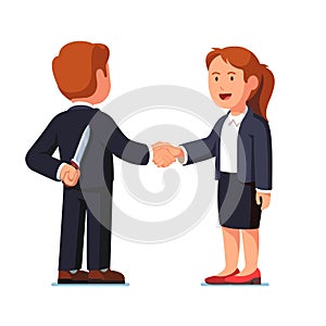 Business woman and man standing shaking hands