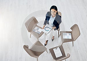 Business woman, meeting and empty waiting room with documents on chair above in team appointment at office. Top view of