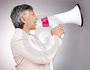 Business woman, megaphone and protest, breaking news or broadcast for gender equality and justice in studio. Serious