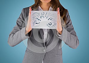 Business woman mid section with card showing blue arrow doodles against blue background