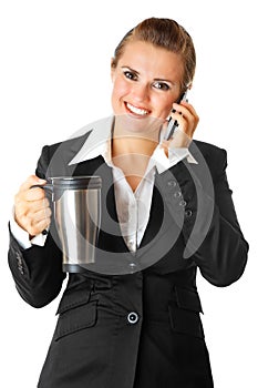 Business woman with mobile phone and thermos