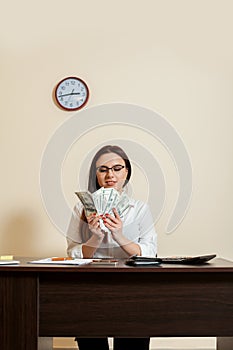 Business woman with money fans in hands