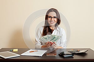 Business woman with money fans in hands