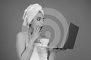 Business woman. Morning freelancer working on laptop. Business woman with towel on head with coffee working on laptop