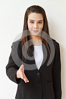 Business woman offering greeting with hand shake photo