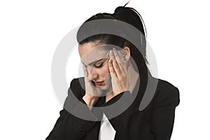 Business woman in office suit suffering migraine pain and strong headache with fingers on her tempo photo