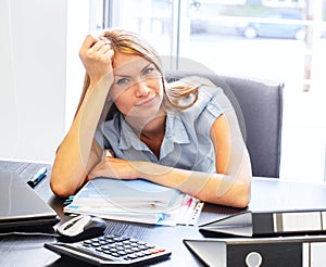 Business woman in office on work place in stress situation