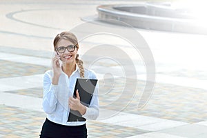 Business woman office worker talking on smartphone smiling happy