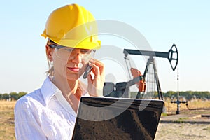 Business woman in an oilfield photo