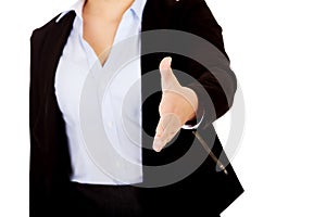 Business woman with an open hand ready for handshake