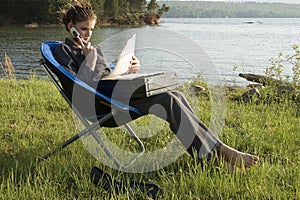 Business Woman Outdoors by Lake photo