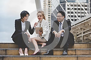 Business Woman Partner talk, meeting team Partnership in modern city together. Diversity Asian Business Partner online meeting