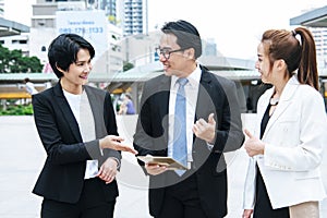 Business Woman Partner talk, meeting team Partnership in modern city together. Diversity Asian Business Partner online meeting