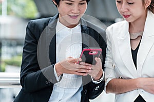 Business Woman Partner talk, meeting team Partnership in modern city together. Diversity Asian Business Partner online meeting