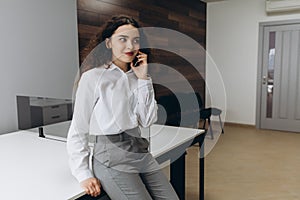 Business woman on the phone at office