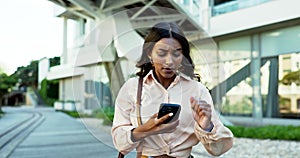 Business woman, phone and running in city for stress, late or bag on urban sidewalk for mobile networking. Asian